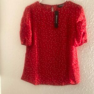 Red Allegra rayon blouse.